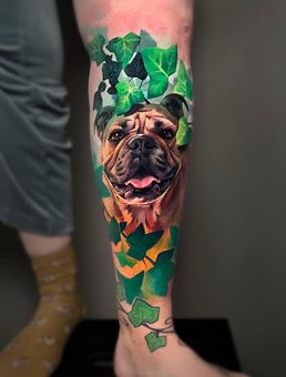A person has a tattoo of a dog on their leg.