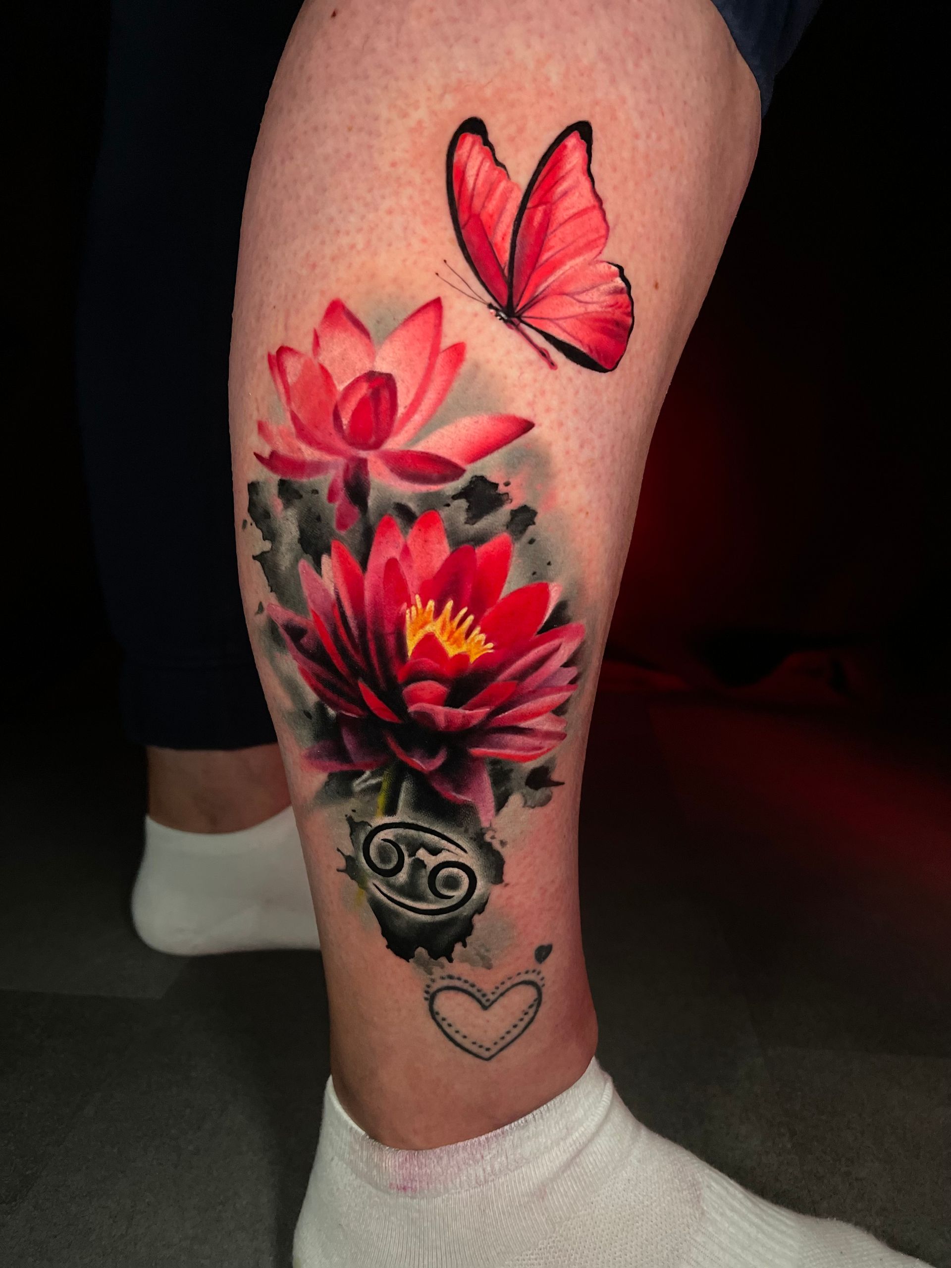 A woman has a tattoo of a skull on her arm.