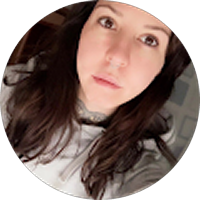 A woman with long brown hair is taking a selfie in a circle.