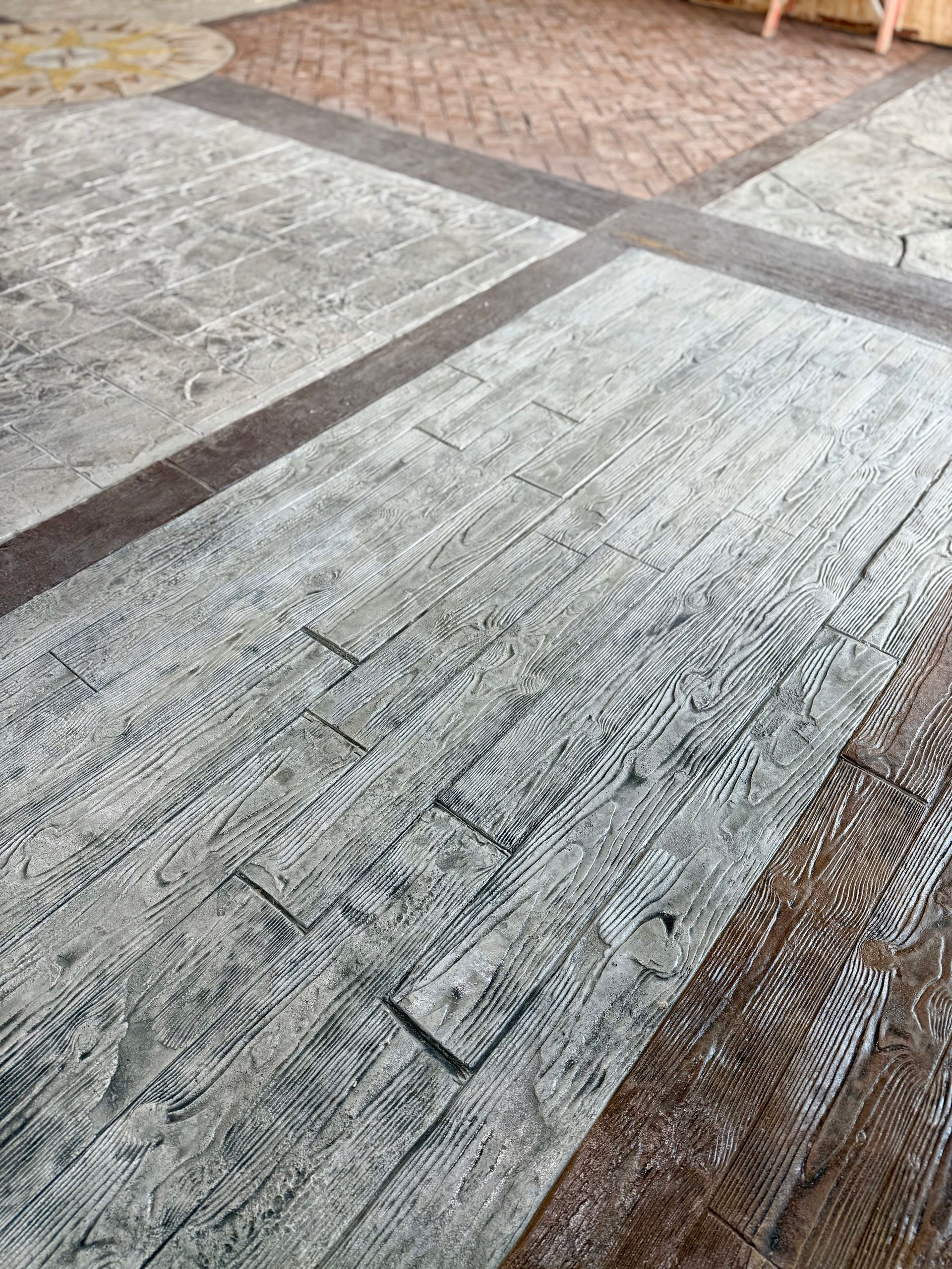 A close up of a concrete floor that looks like wood.
