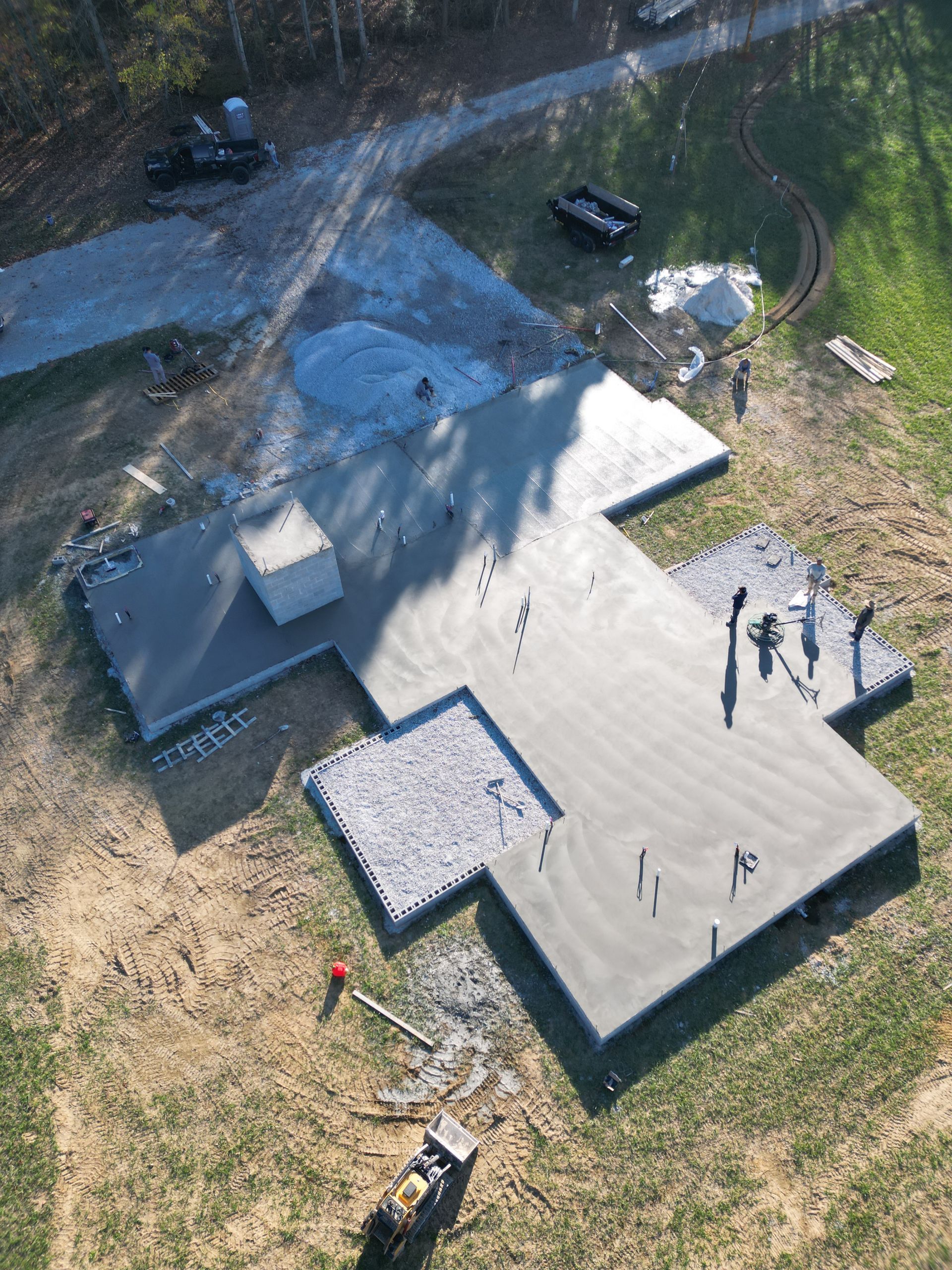 An aerial view of a concrete foundation under construction