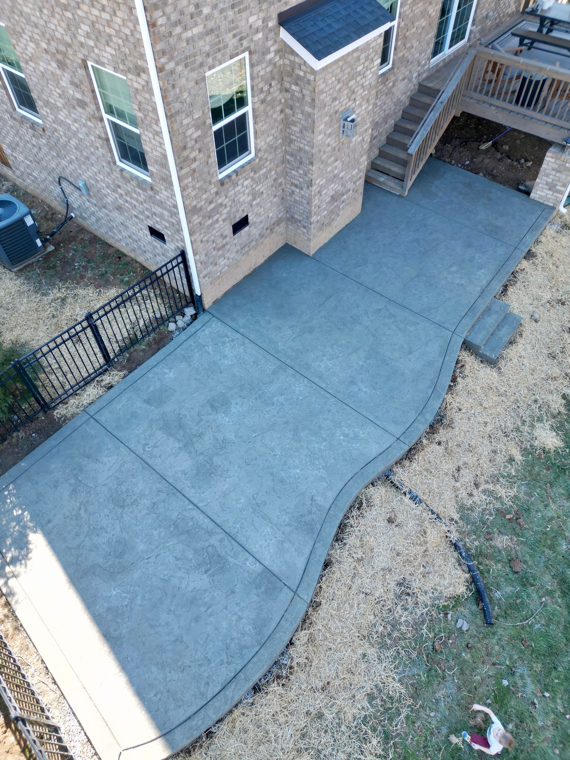 An aerial view of the backyard of a house