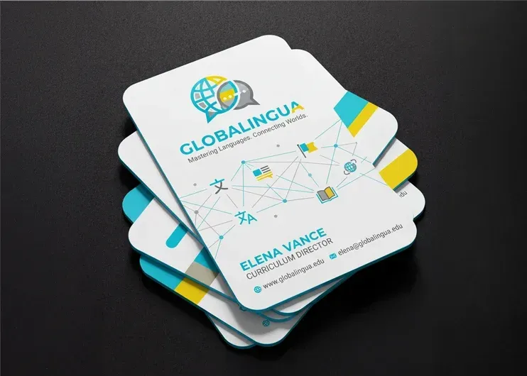 Stack of white printed cards with blue and teal graphics. Curved corners, die cut print and design at Total Creative, Auckland NZ