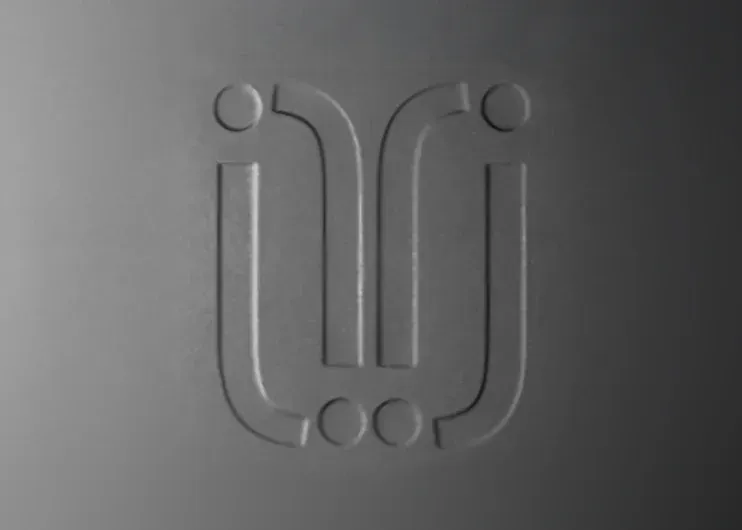 Embossed black logo and print Julinda's logo symbol at Total Creative