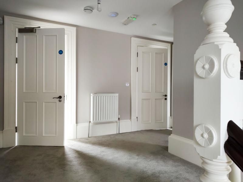 A picture of a landing painted grey matt by Signature Painters and Decorators York