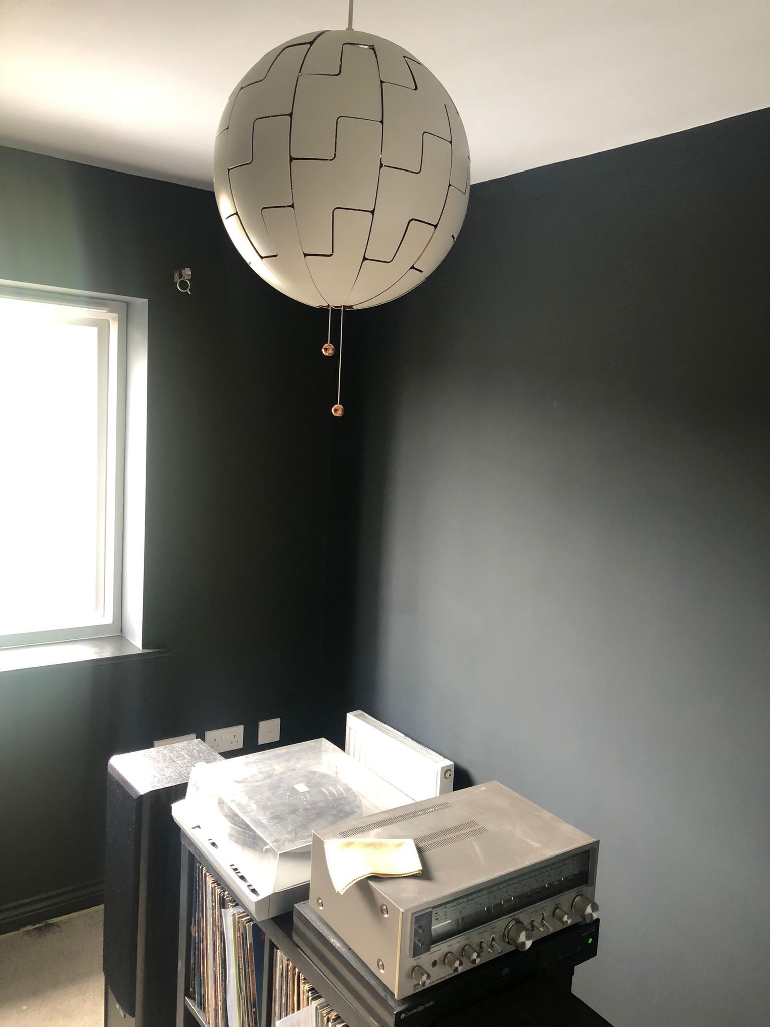 A picture of a bedroom painted dark grey by Signature Painters and Decorators in York