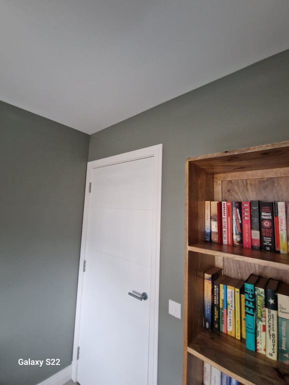 A picture of  a study painted khaki green with a white ceiling by Signature Painters and Decorators York