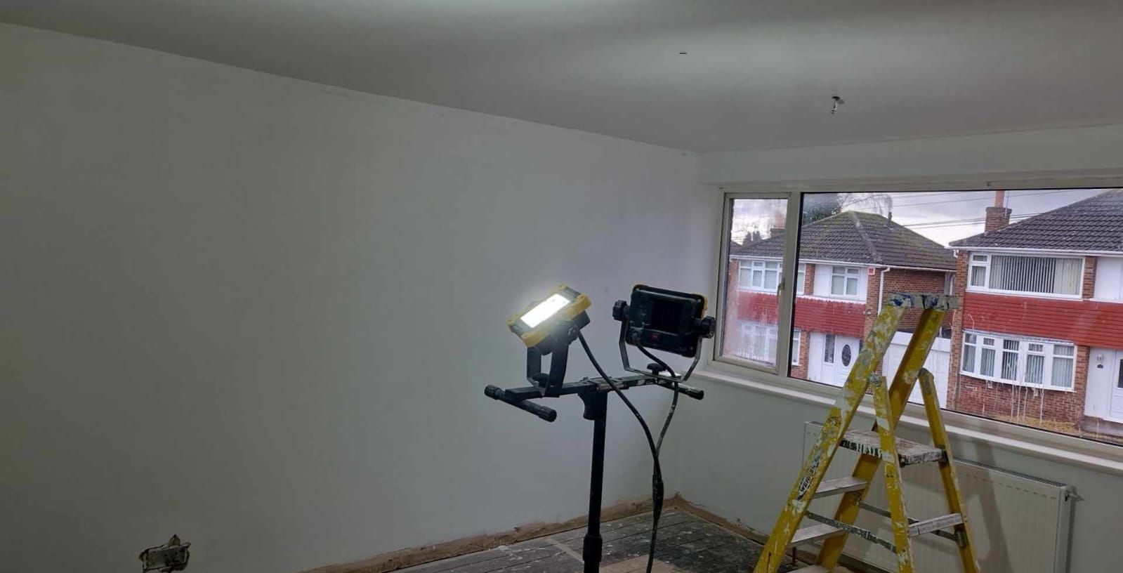 A picture of a bedroom painted white by Signature Painters and Decorators York