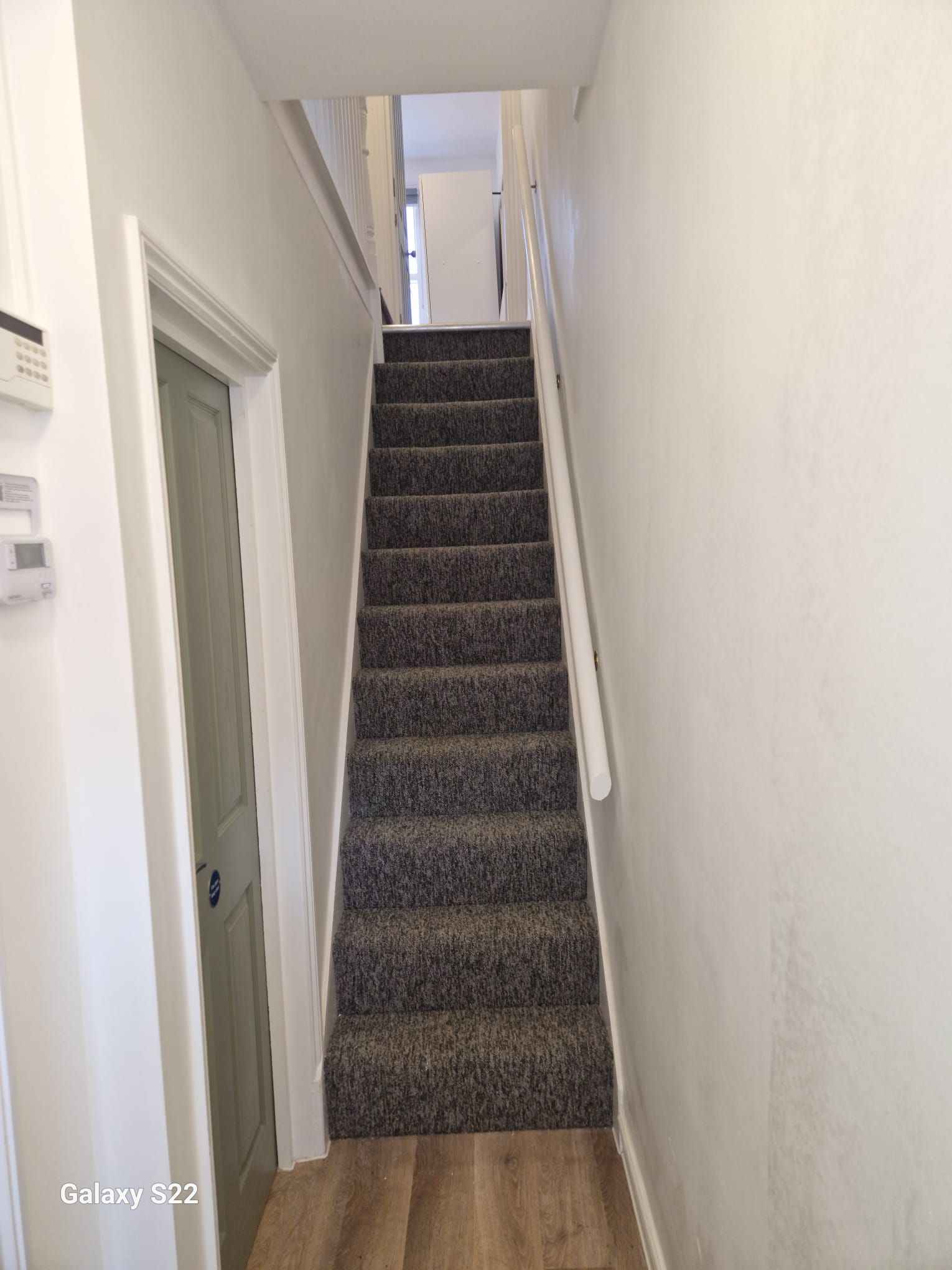 A picture of a staircase painted white in a property at  Penyghent Avenue at  Signature Painters and Decorators York
