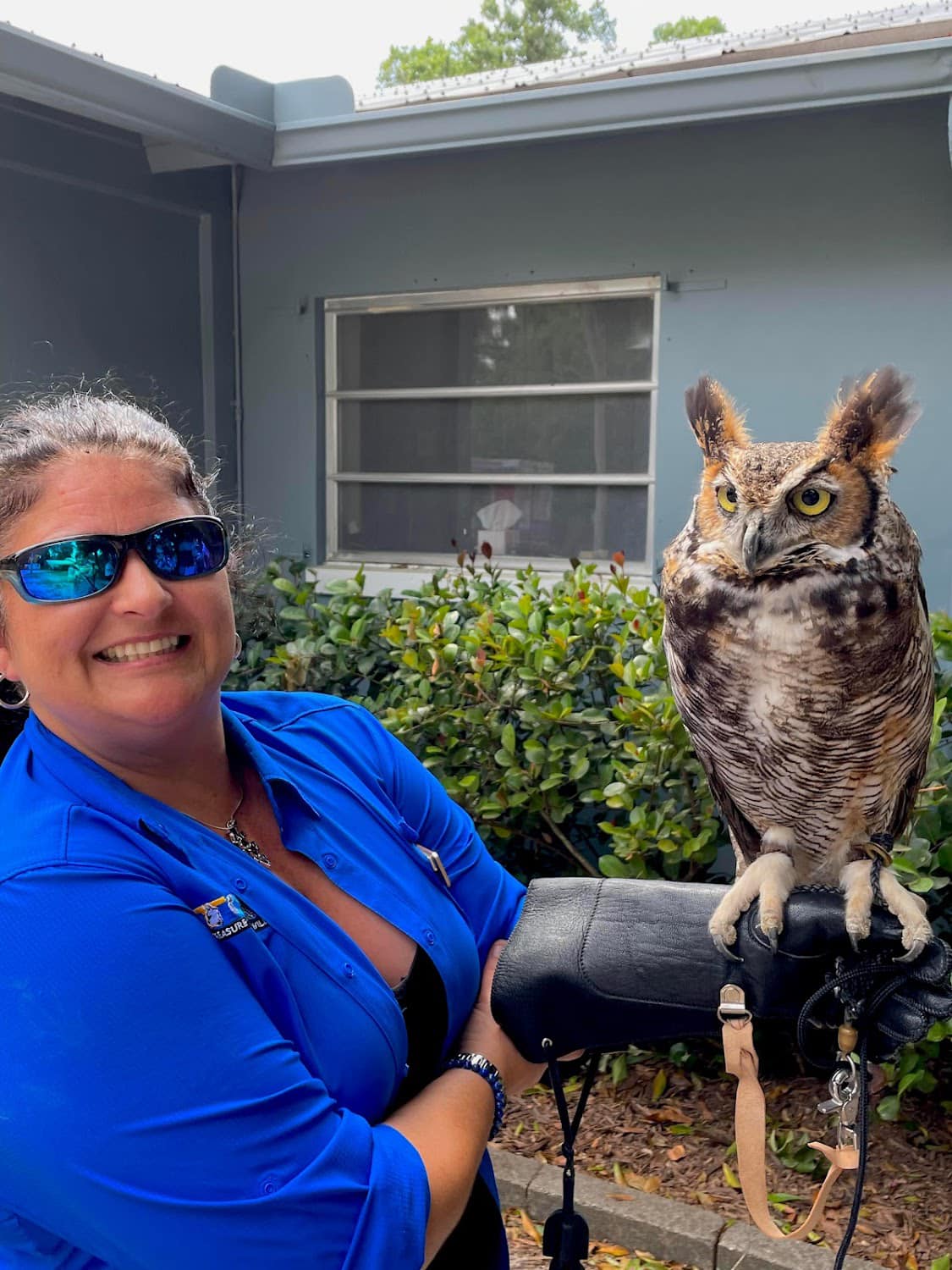 Director holding a Great Horned Owl