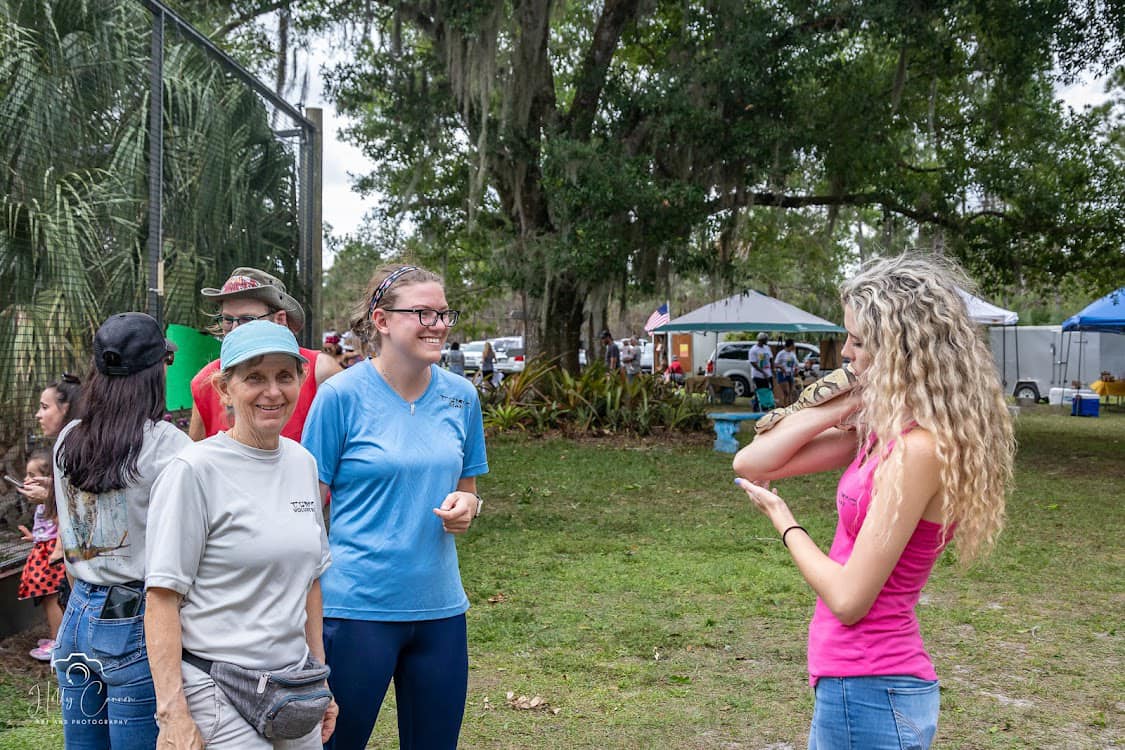 rehabber holding a snake
