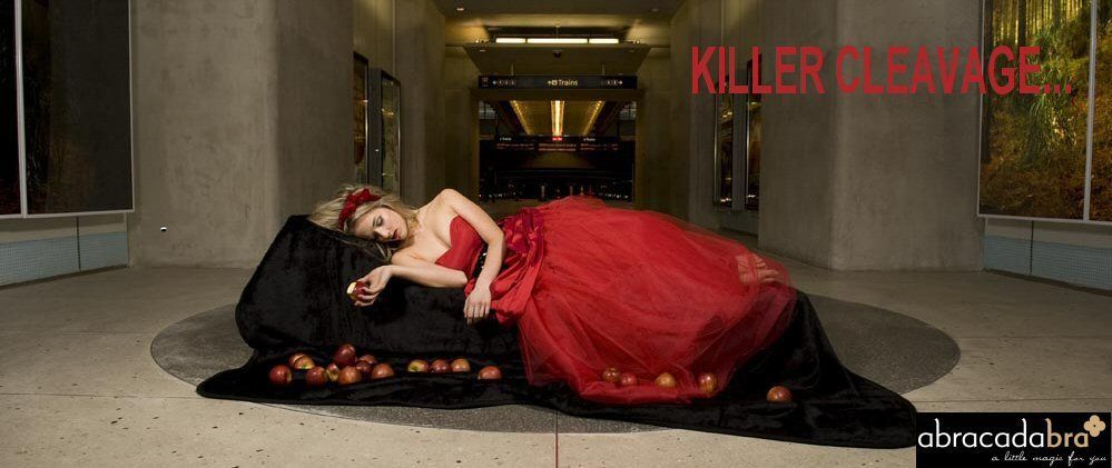 Woman in red gown lying on black cloth with apples, outdoors with text 
