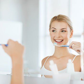 Cosmetic Dentistry — Brushing Teeth in Louisville, Kentucky