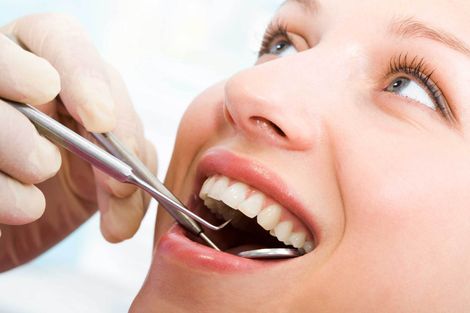 Dentist examining women's teeth — Armadale, WA — Acorn Dental Centre
