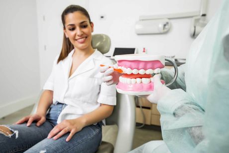 Dentist demonstrating teeth cleaning — Armadale, WA — Acorn Dental Centre