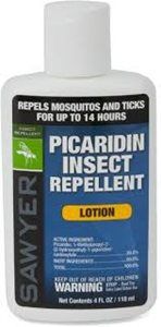 A white plastic bottle of Sawyer Picaridin Insect Repellent lotion with a blue label detailing ingredients and warnings.