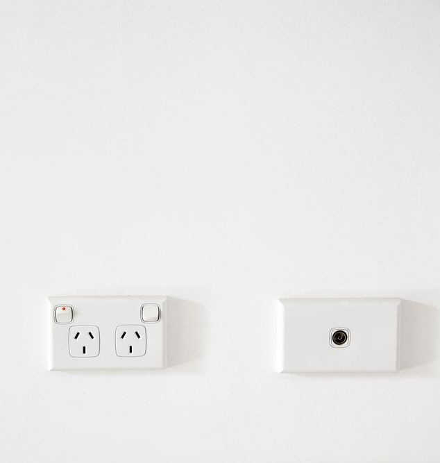 A White Wall With Three Electrical Outlets and a Light Switch — A1 Antenna Doctor In Port Macquarie, NSW