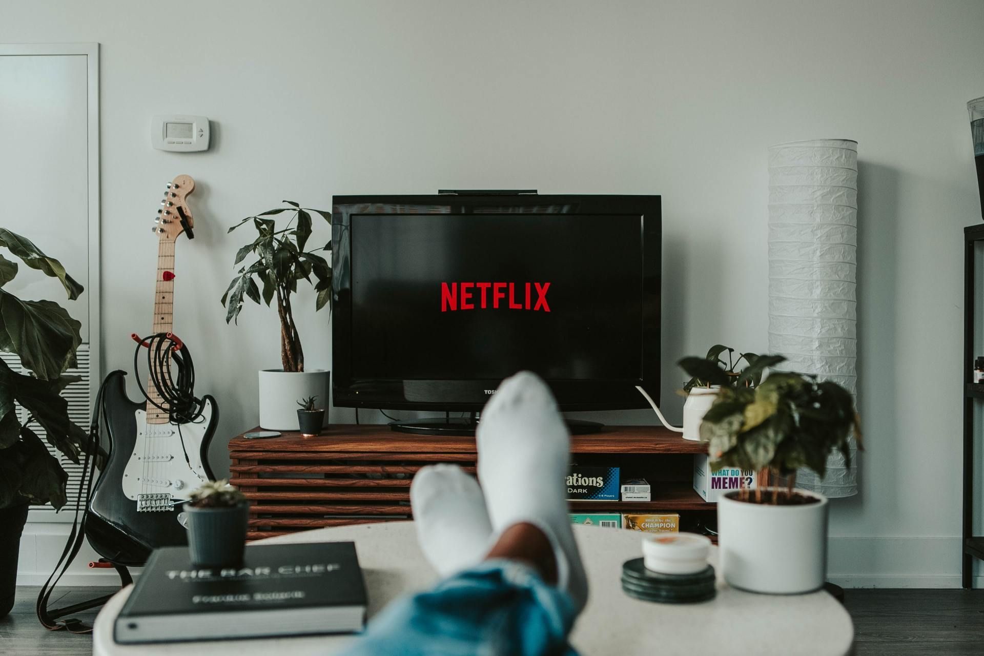 A Person Is Watching Netflix on A Flat Screen Tv in A Living Room — A1 Antenna Doctor In Port Macquarie, NSW