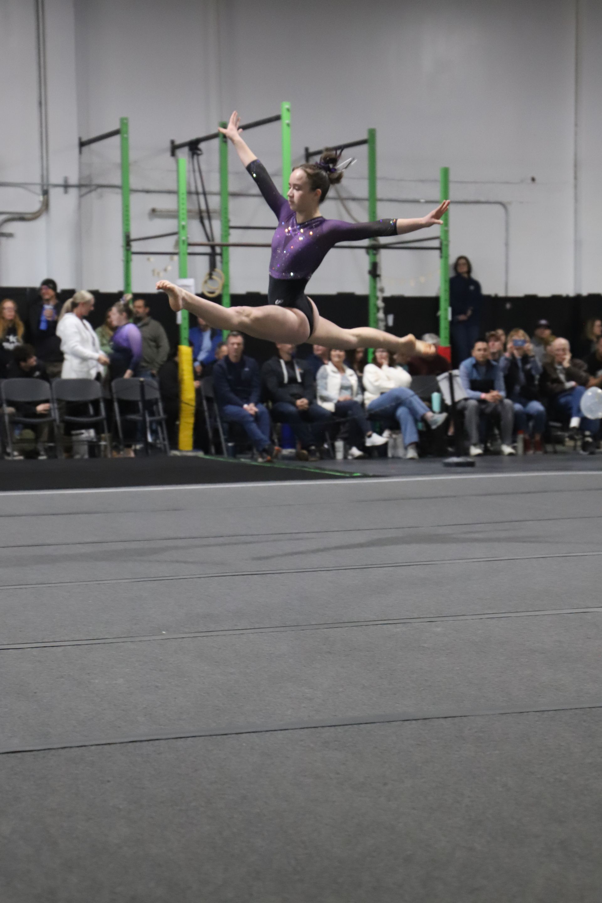 2025 Carnival Masquerade Gymnastics Meet at Pacific Edge Sports Academy - Featured Image - Split leap perfection on floor