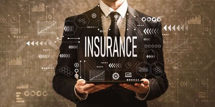 man holding text saying Insurance