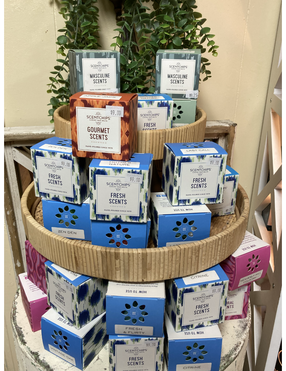 A group of pink teddy bears are sitting on a shelf