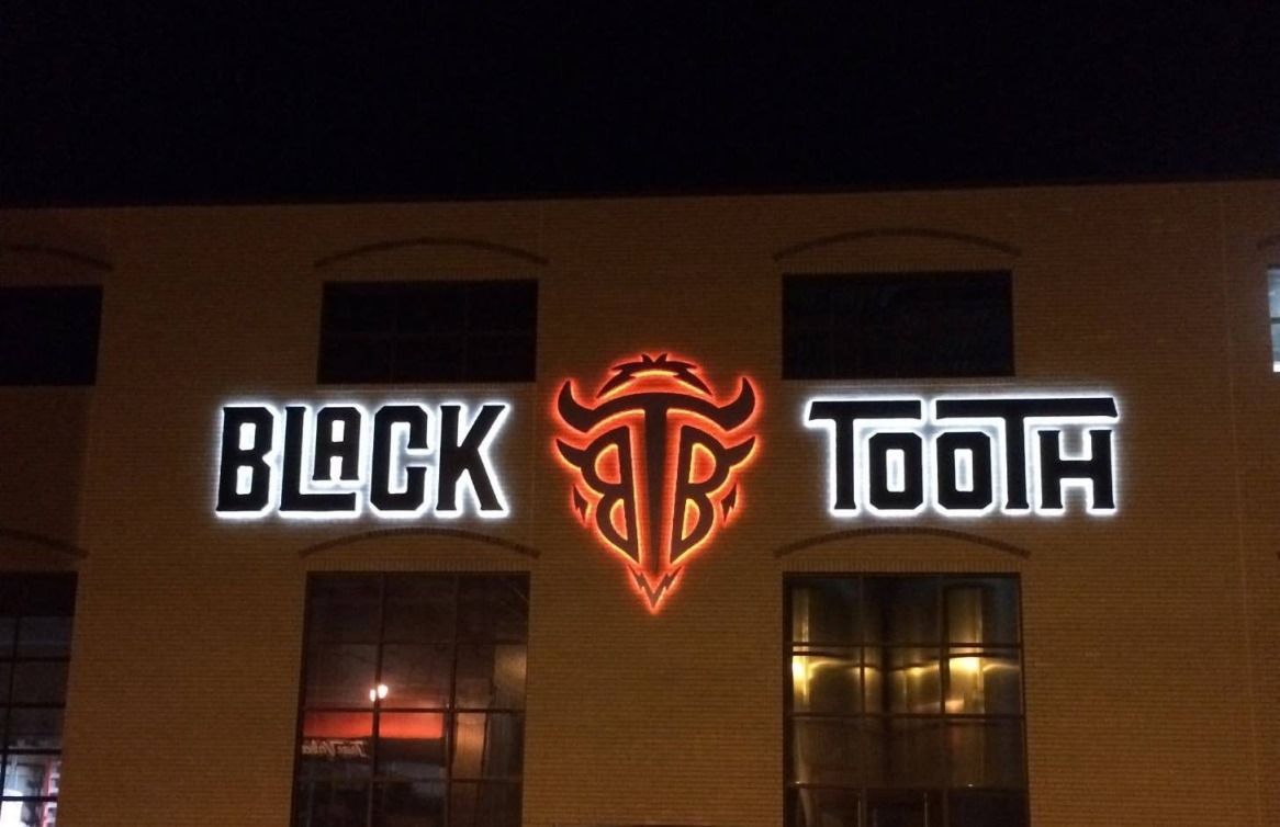 Custom LED business sign with vibrant colors and energy-efficient lighting in Apex, NC.