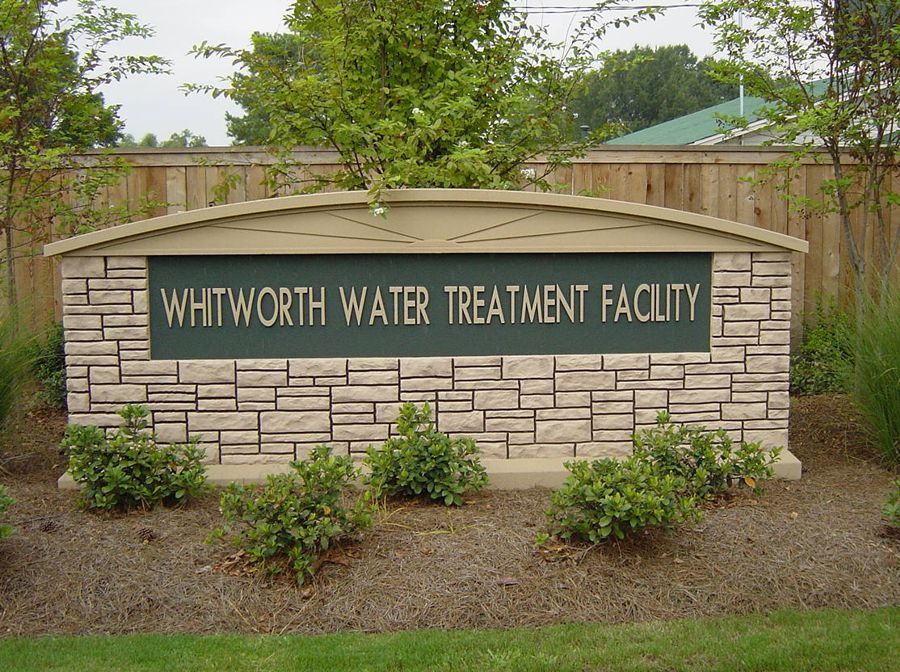Custom monument sign in Apex, NC by Carolina Signs & Wonders showcasing durable, elegant design for enhanced business visibility.