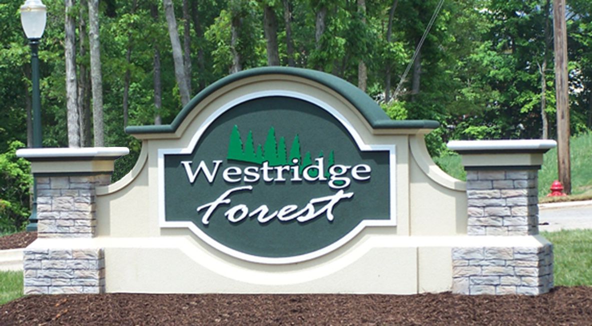Durable and elegant monument sign in Apex, NC crafted with granite, concrete, aluminum, brickwork, and HDU foam by Carolina Signs & Wonders.