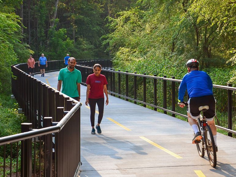People Walking in Big Creek - Cumming, GA - Potts Towing