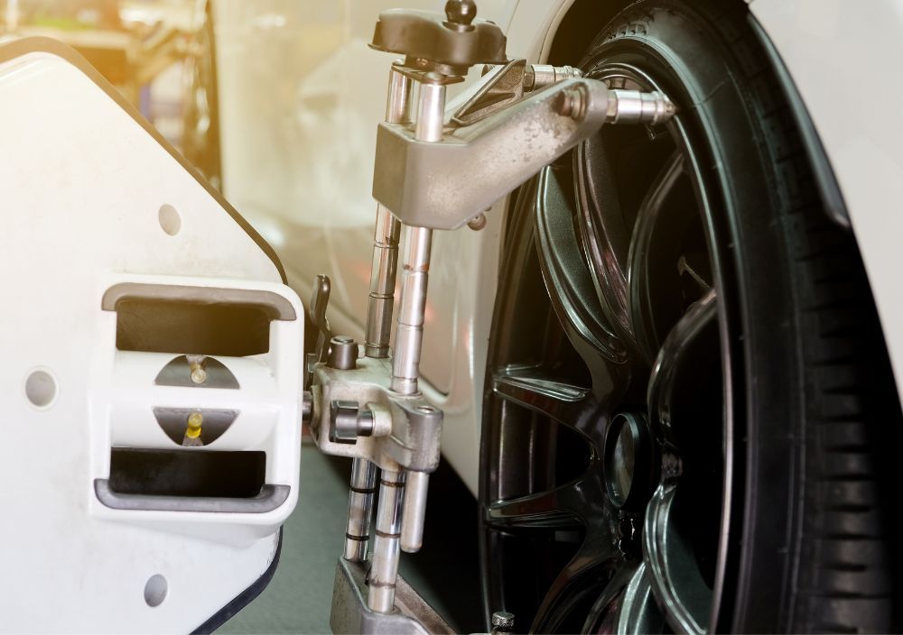 wheel alignment device fixed onto the car wheel