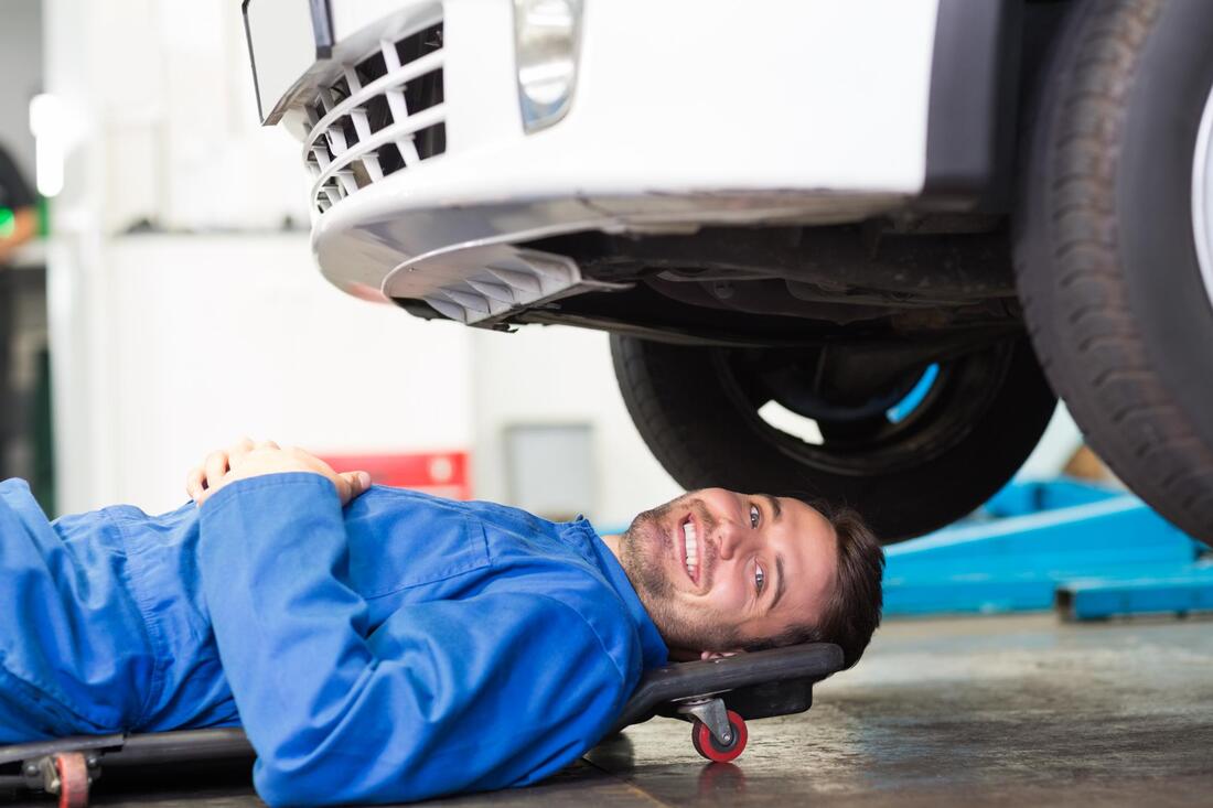 about to check under car as part of Mobile Mechanic Reading's car MOT service