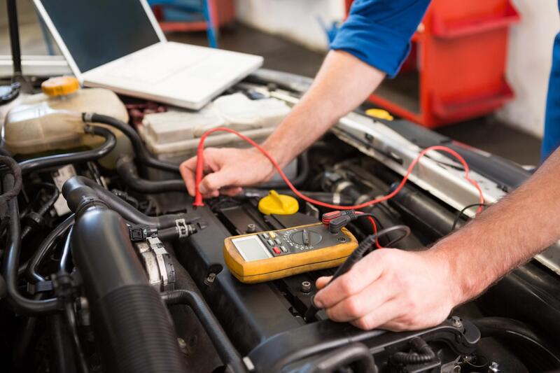 Part of car MOT service in workshop in Reading