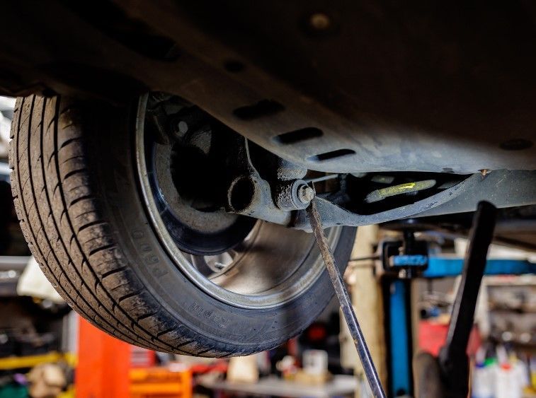 about to check under car as part of Mobile Mechanic Reading's car MOT service for a Sonning customer