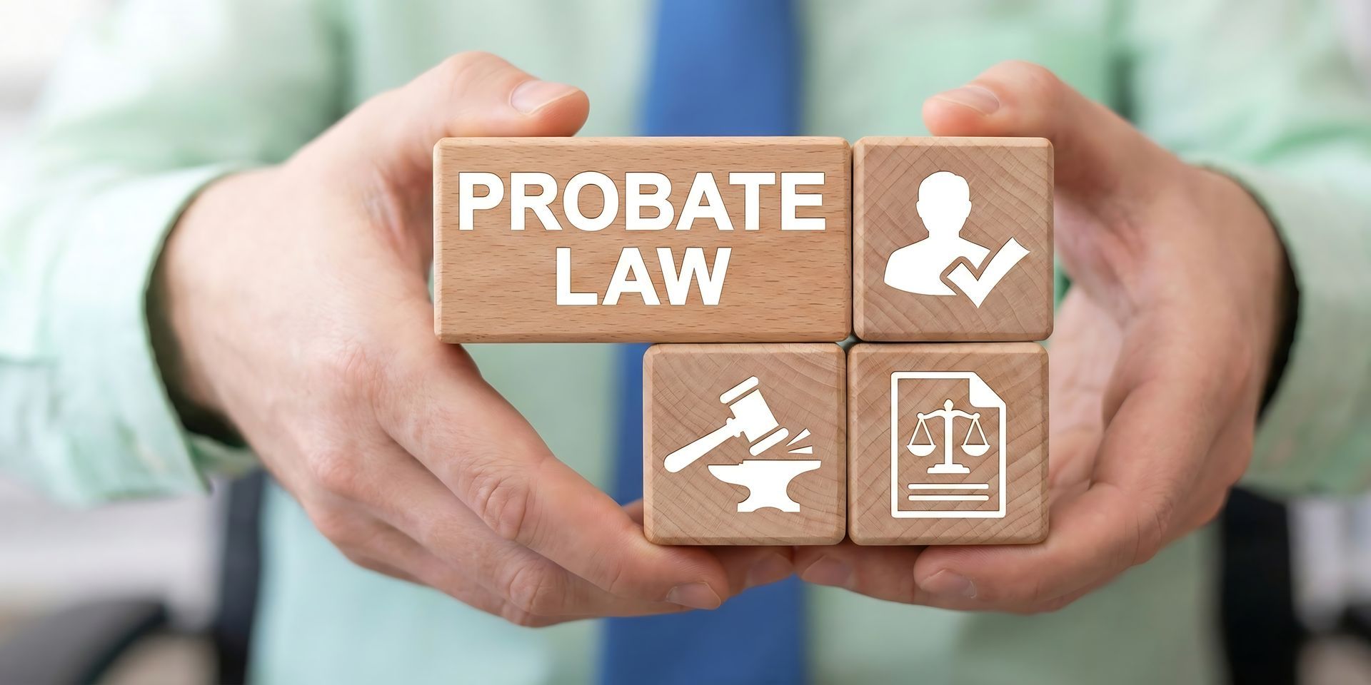 Lawyer holding probate law wooden blocks with icons for estate inheritance and court services.