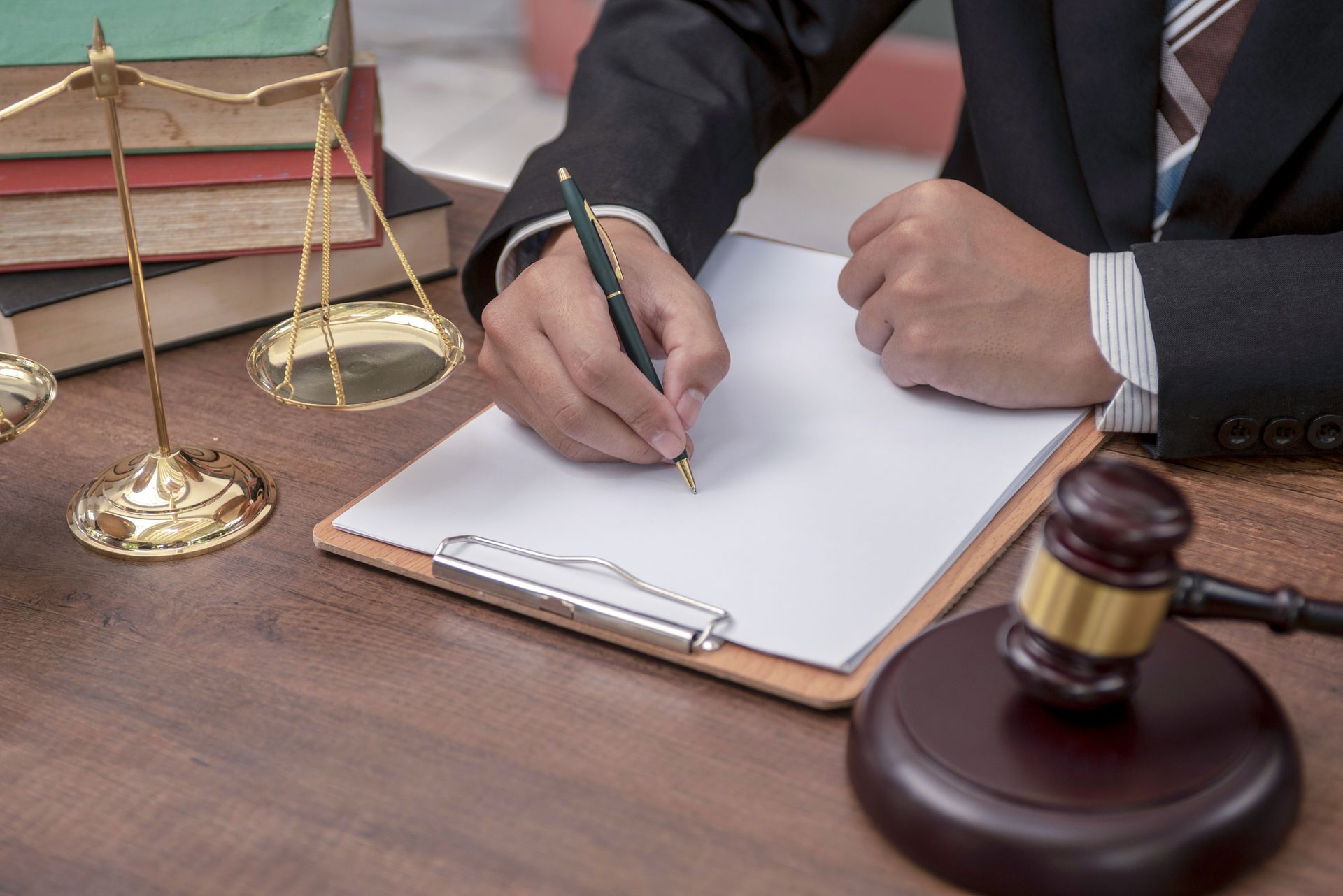 Judge’s gavel with model house and lawyer offering legal probate advice.