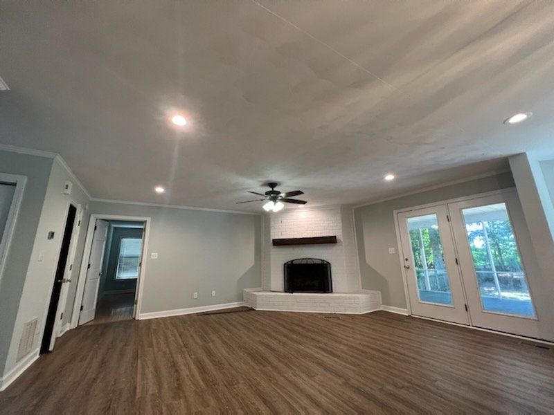 Carpenter Installs Hinge On Cabinet - Hampton, VA - Hatchett Electrical Services