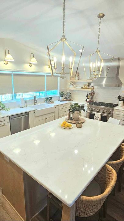 There is a large island in the middle of the kitchen.