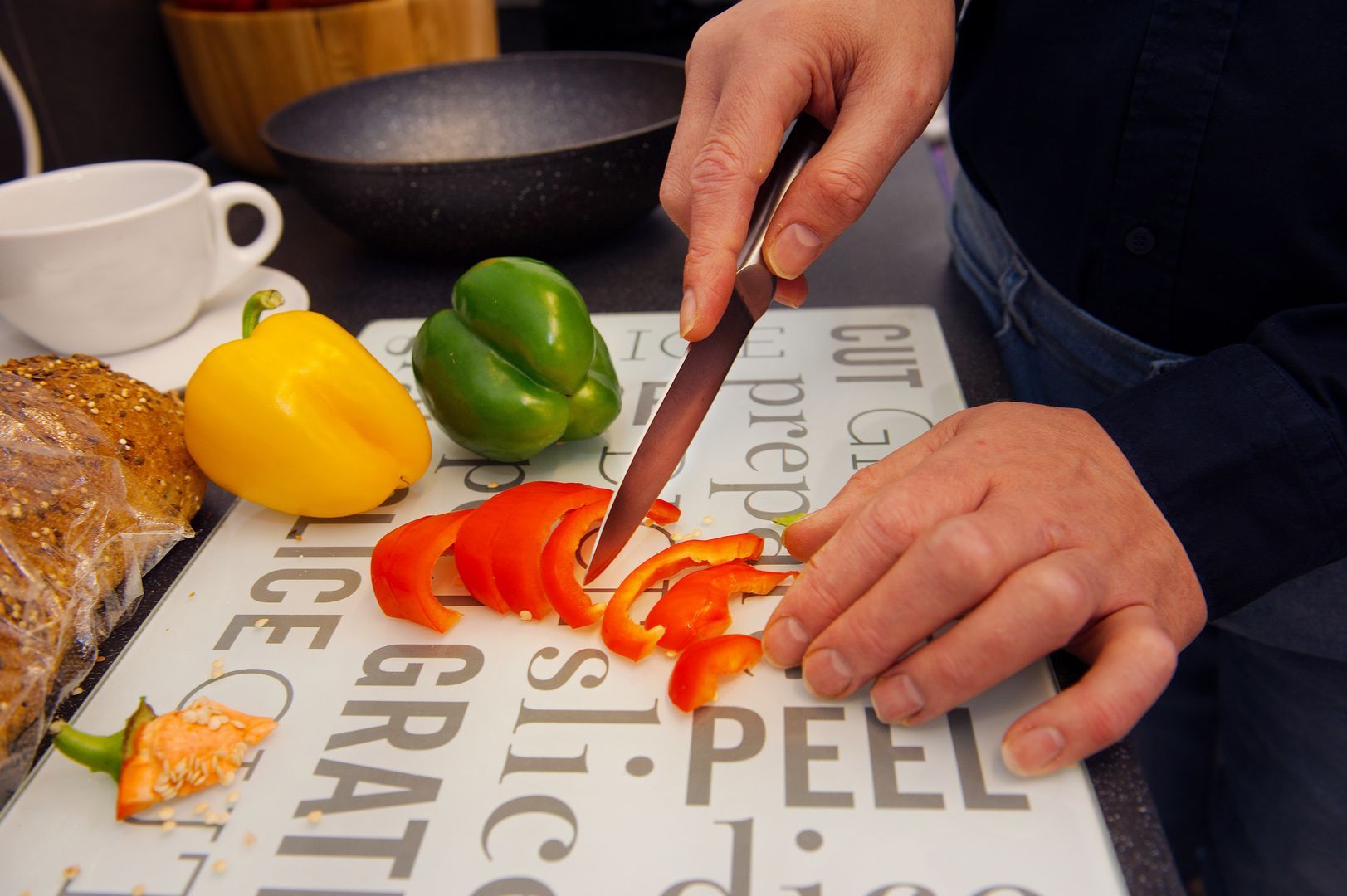 Philip Anderson preparing a bellpepper into neat slices.