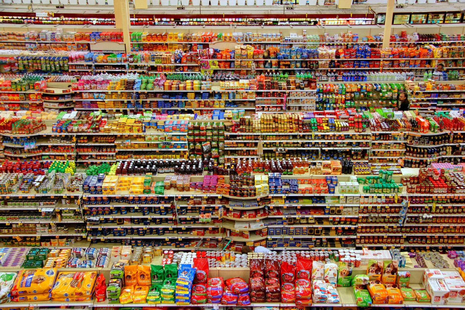 (Accessible Store Layout) An overhead shot of a supermarket, displaying its cramped aisles and packed shelves.