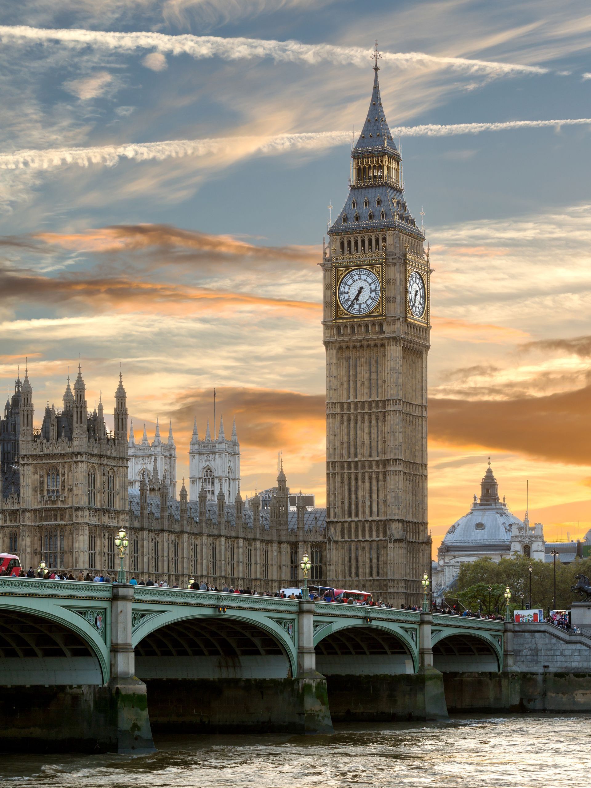 The Houses of Parliament and Elizabeth Tower, with Westminster Bridge in the evening.