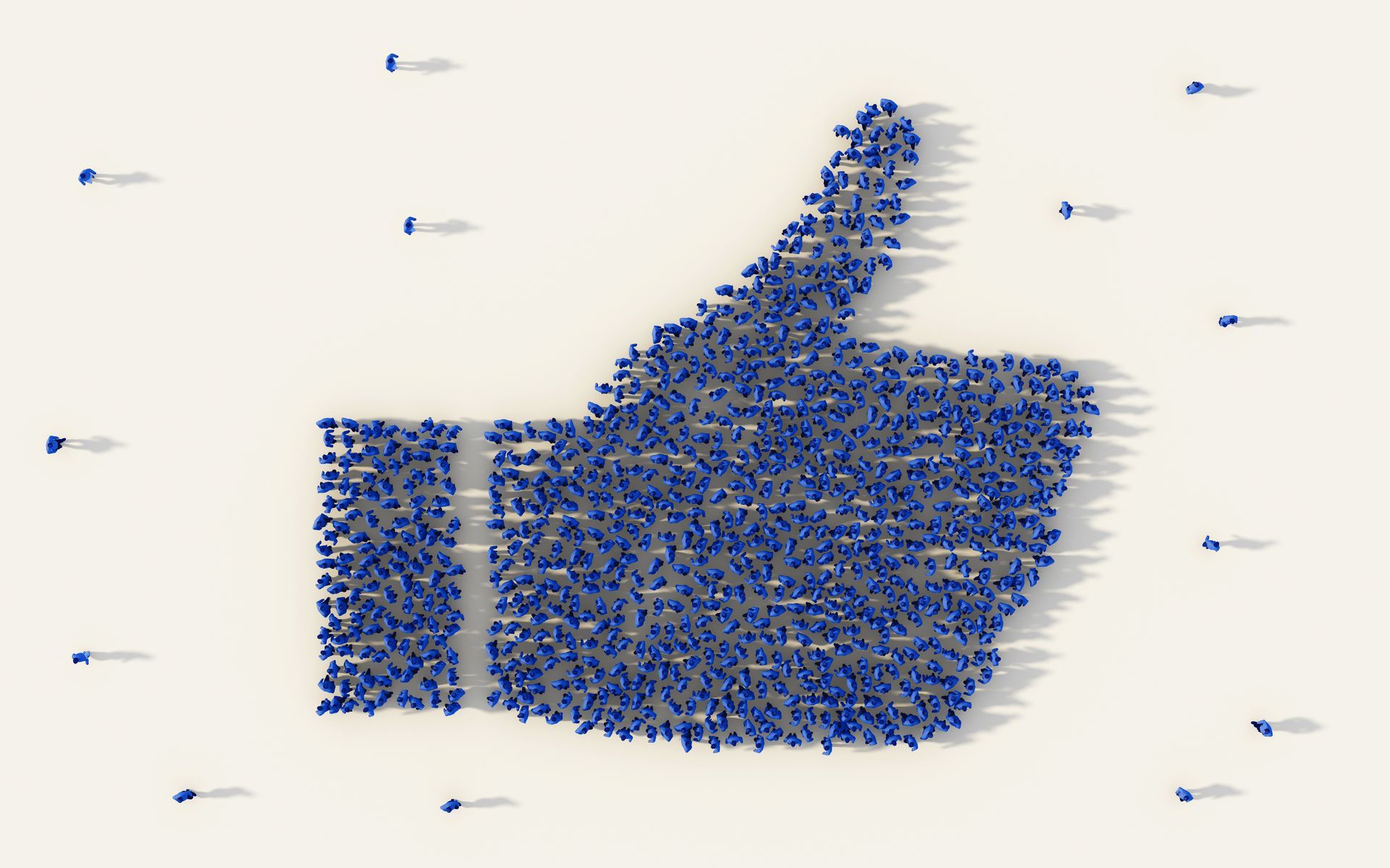A group of people stand to form a Facebook 'Like' thumbs up, but some stand at a distance, excluded.