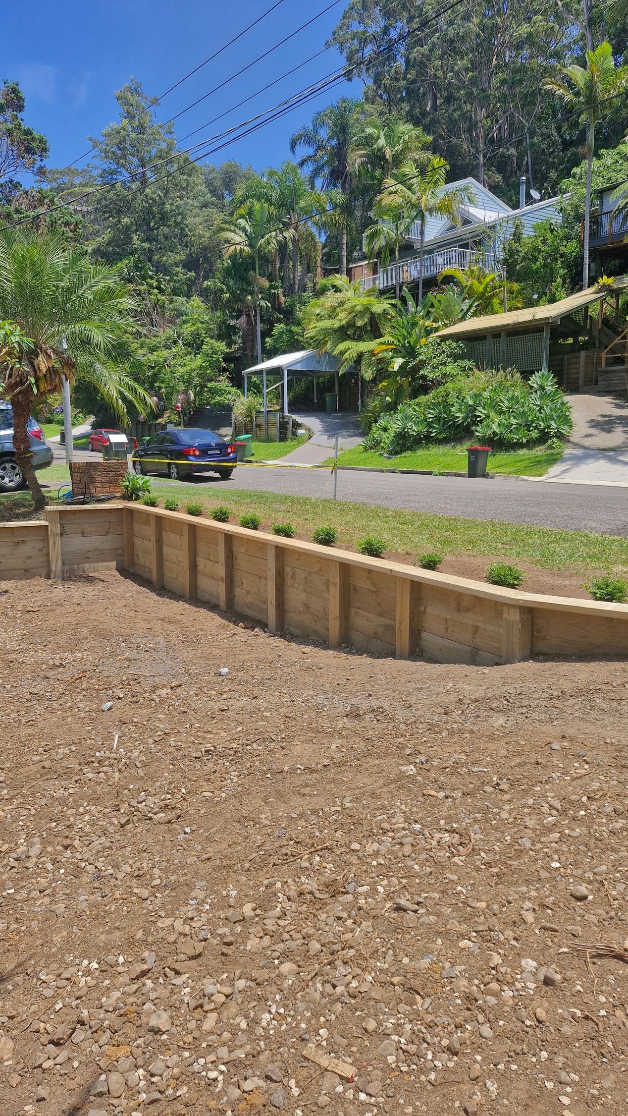 A White Fence Surrounds a Large Swimming Pool — Strike Fencing & Gates in Avoca, NSW