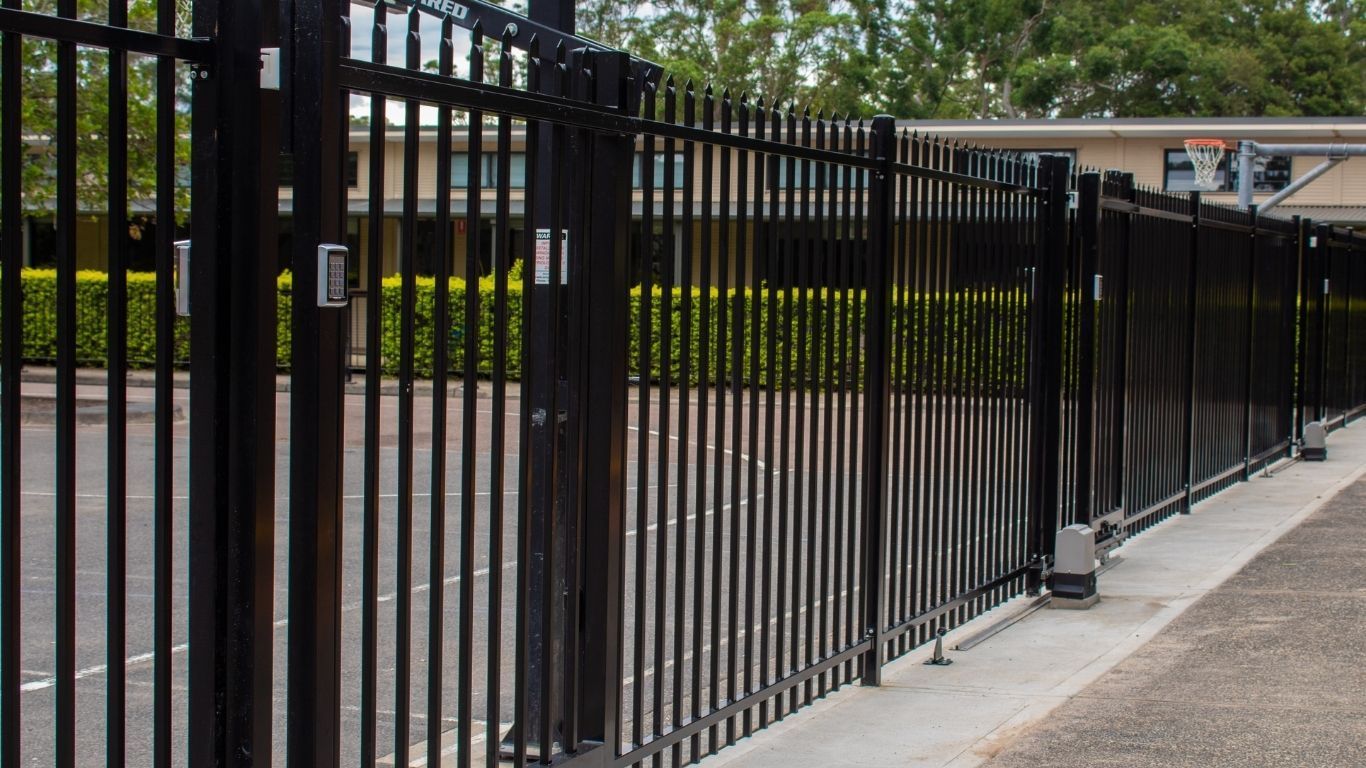 black automatic security gate installed on a Central Coast property with keypad access