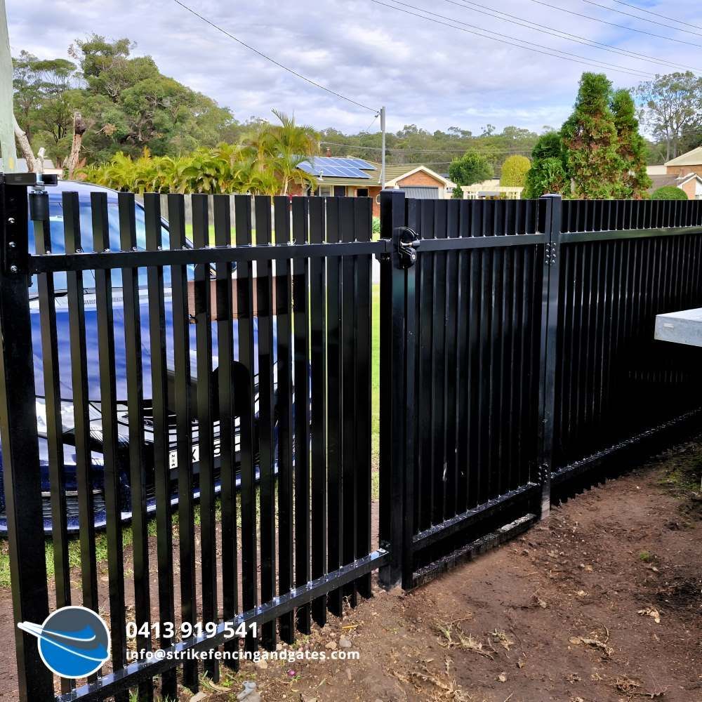 A Black Fence With the Number 0413191541 on It — Strike Fencing & Gates in Killarney, NSW