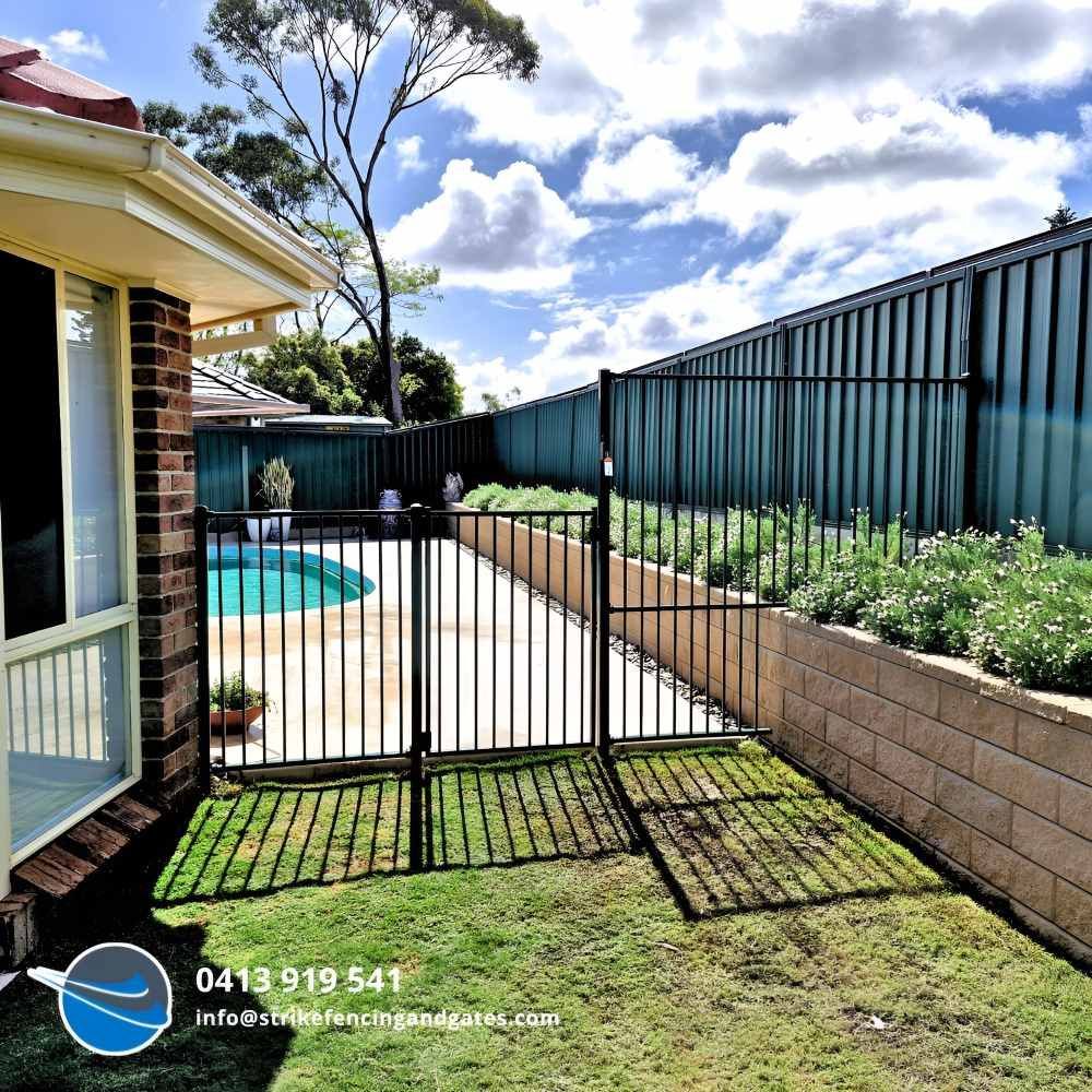 A House With a Fence and a Swimming Pool in the Backyard — Strike Fencing & Gates in Avoca, NSW