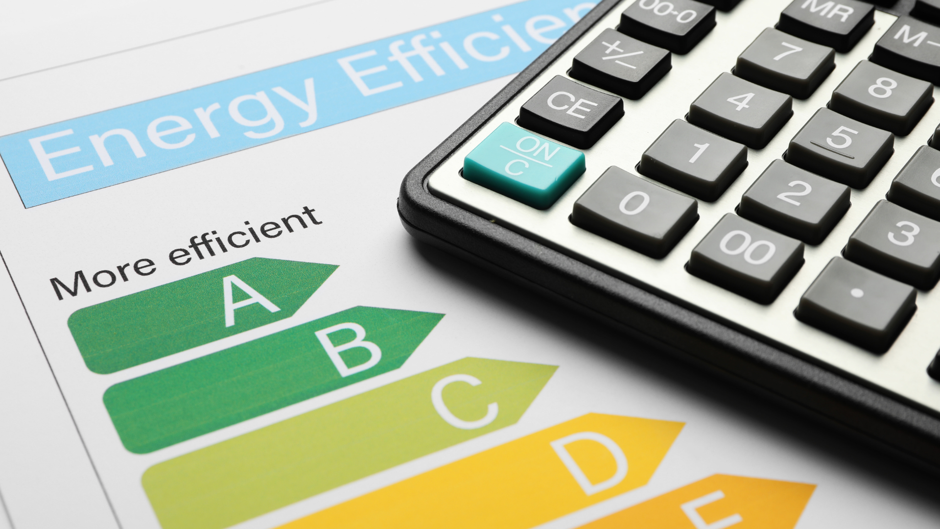 Energy efficiency document with a calculator, showing an A-D rating scale.