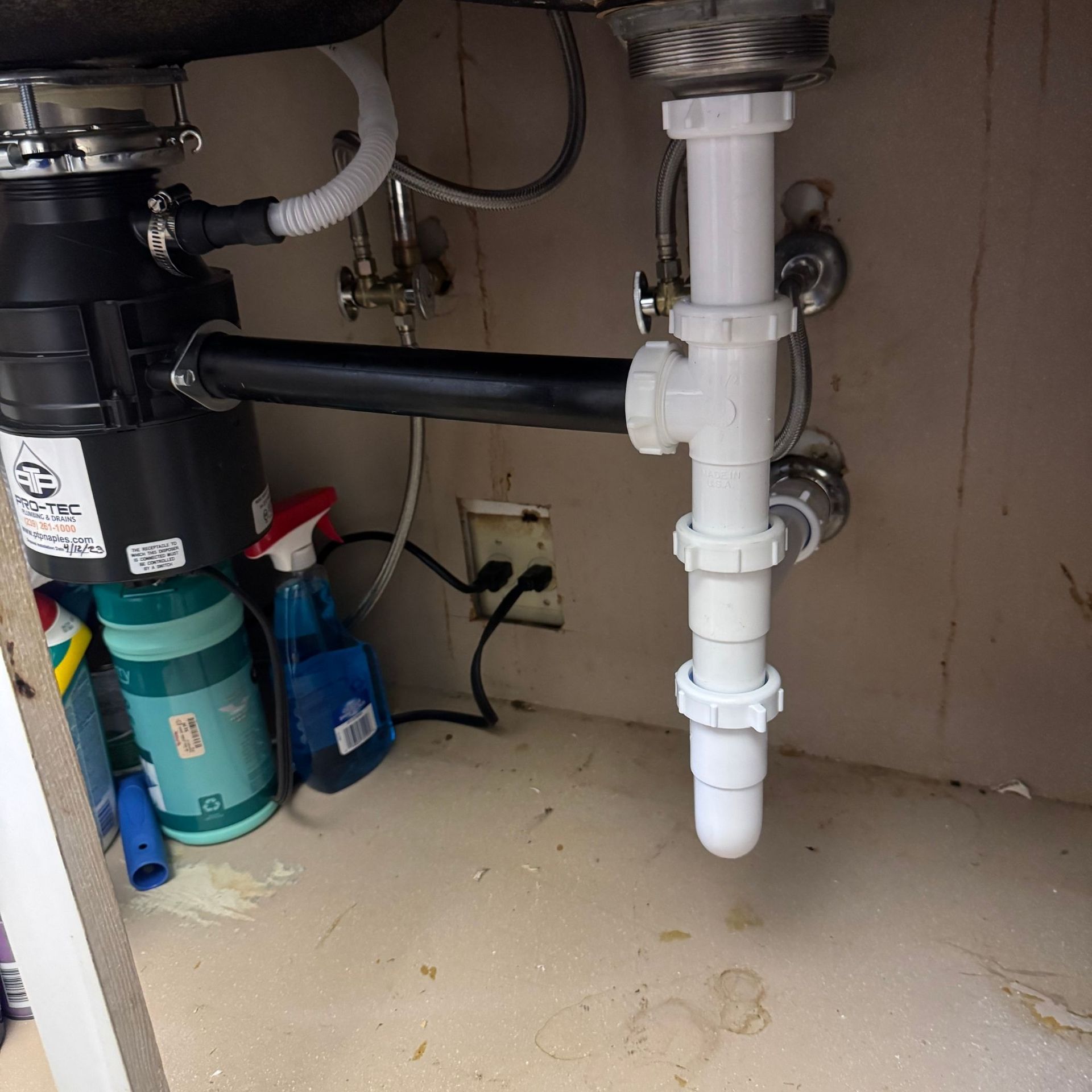 Tarpon Plumbing & Drains - A sink with a garbage disposal underneath it