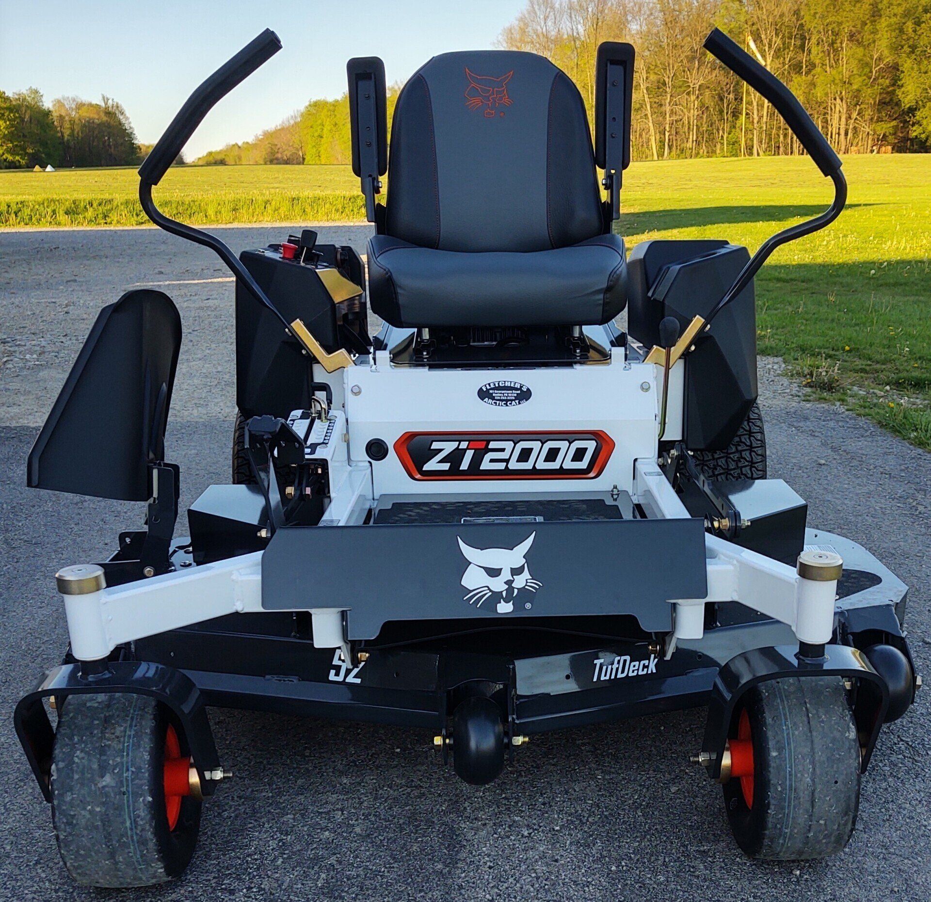 A bobcat zt2000 lawn mower is parked on the side of the road