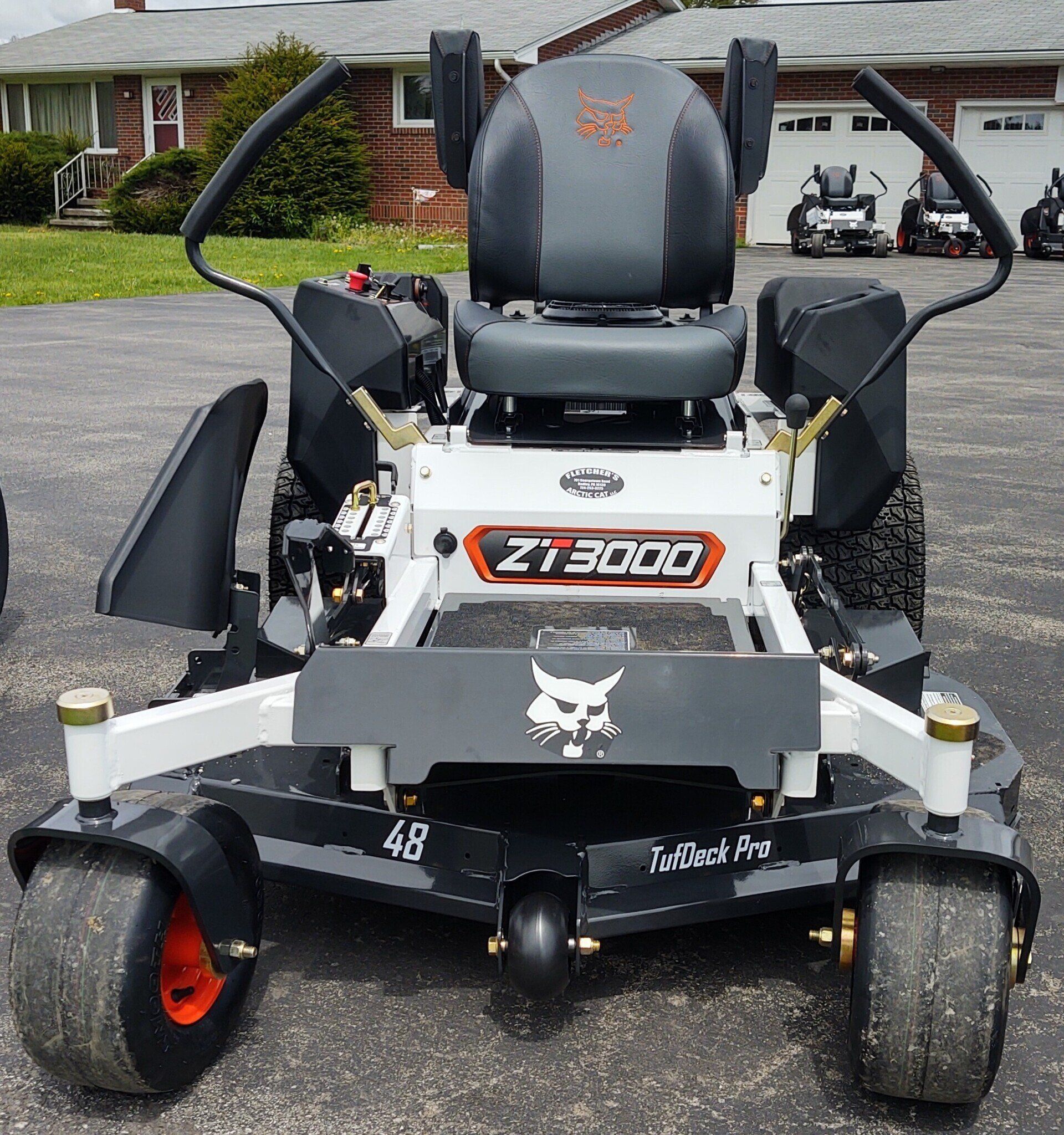 A bobcat zt3000 lawn mower is parked in a driveway