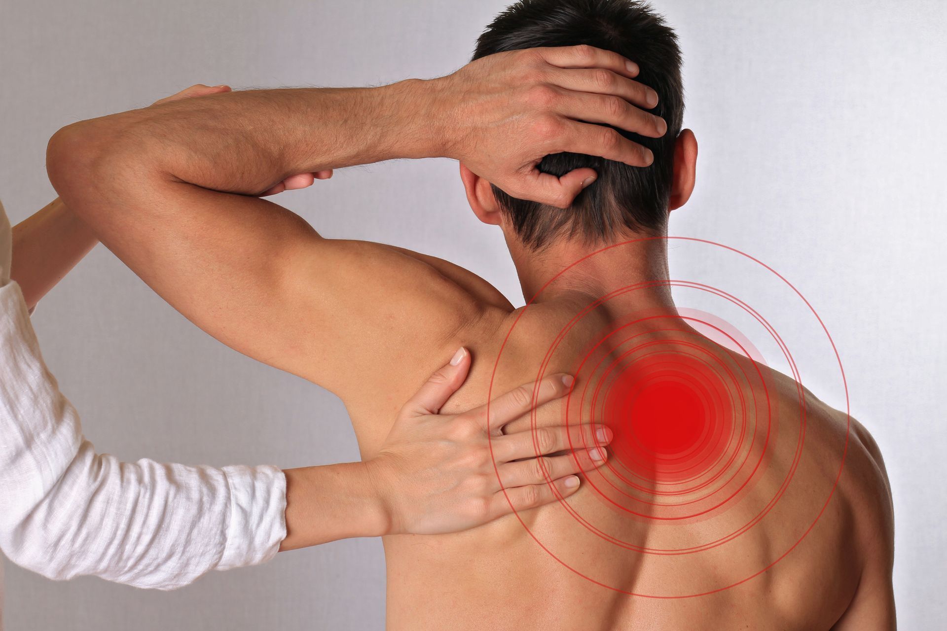 Man receiving spinal care, showcasing chiropractic therapy, physiotherapy, and wellness support.